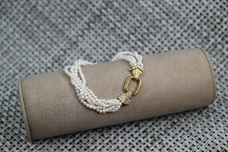 ladies-multi-strand-pearl-bracelets-18k Yellow Gold and Diamond Fresh Water Cultured White Pearl Multi Strand Bracelet