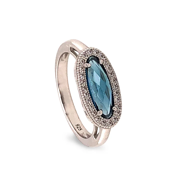 Ladies rings for cozy vibes -Platinum Finish Sterling Silver Micropave Oblong Ring with Simulated London Blue Topaz and Simulated Diamonds